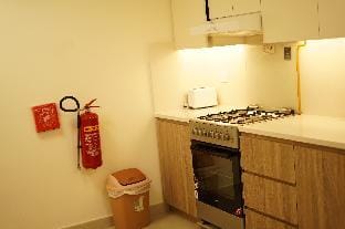 Brown Stone - Mirdif hills Dubai Airport Apartment in Al Sharjah
