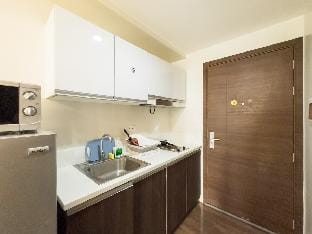 Cozy Woodland Retreat 1BR in Air Residences 2X52 Apartment in Makati