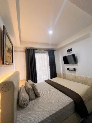 Studio 2 Apartemen Grand Asia Afrika by Lekgin Apartment in Bandung