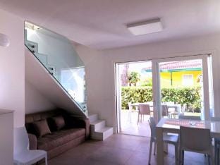 Stunning villa with private garden and fireplace by Beahost Rentals Villa in Bibione