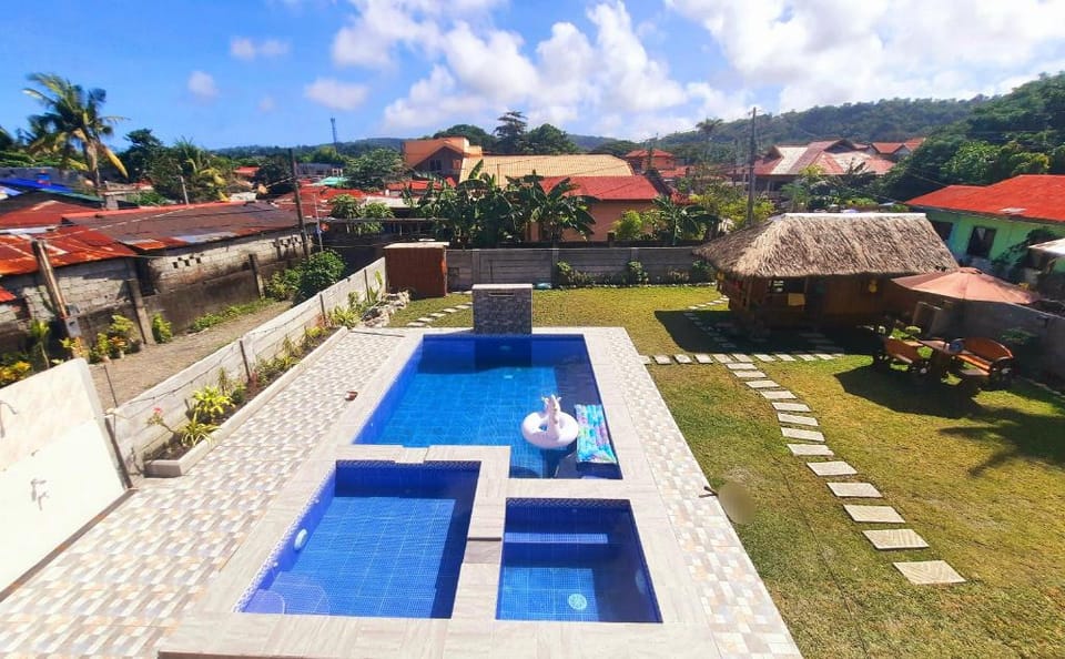 LS Resthouse-Loft Studio w/ kitchen & pool access Apartment in Calabarzon