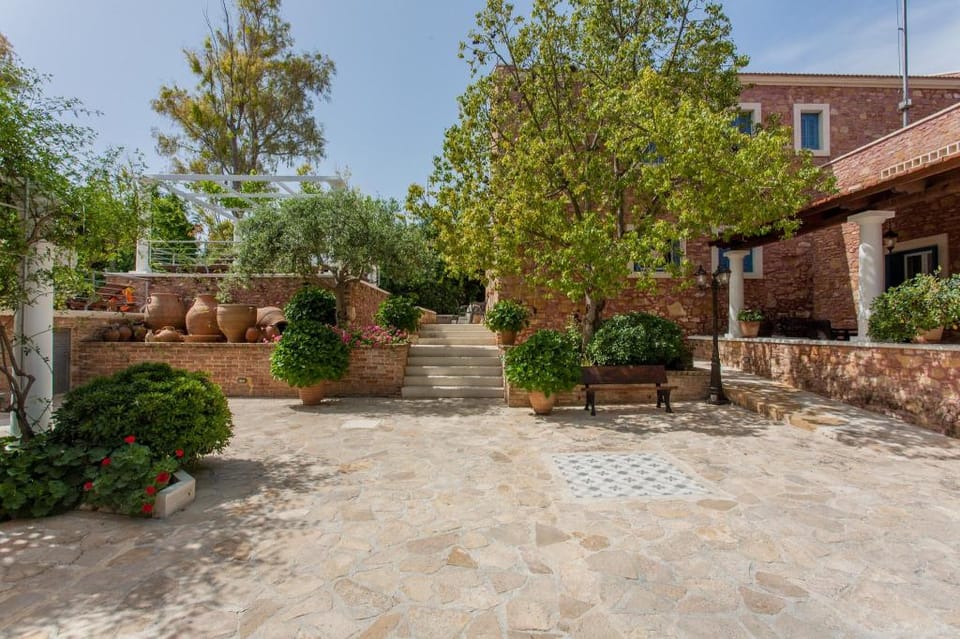 Dine on the Generous Veranda at a Rustic Stone Getaway Apartment in Crete