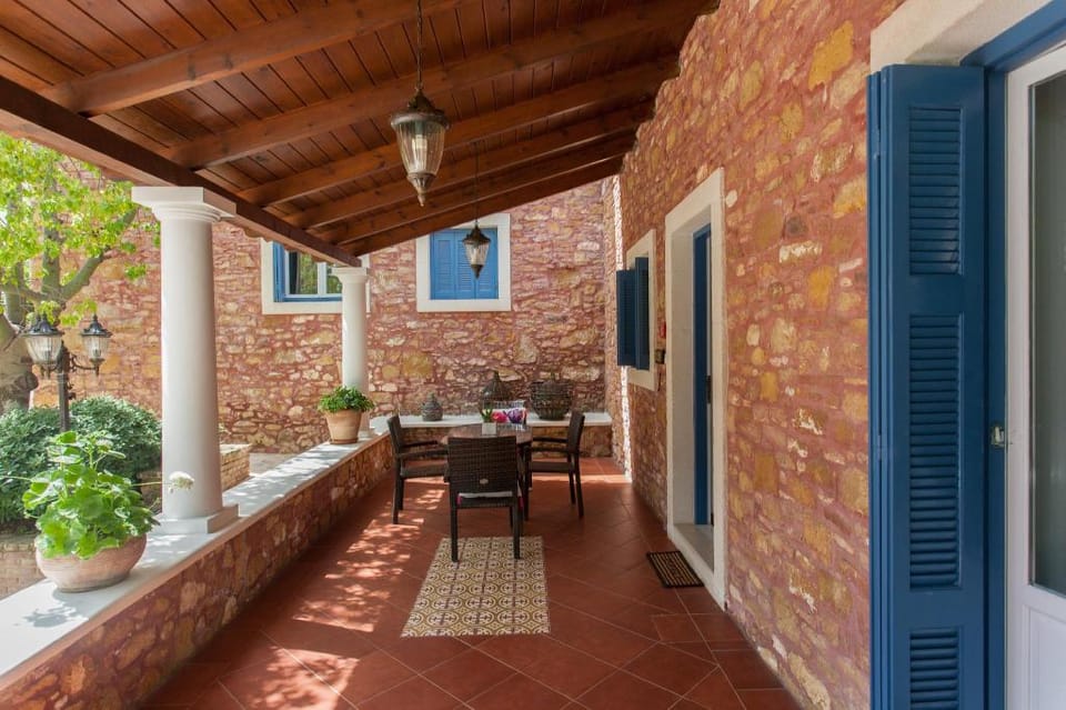 Dine on the Generous Veranda at a Rustic Stone Getaway Apartment in Crete