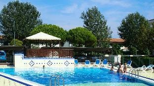 Apartment in residence with swimming pool and private garden by Beahost Rentals Apartment in Bibione