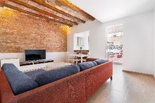 Gràcia Charm: Sunlit Terrace, AC & Exposed Brick Apartment in Barcelona