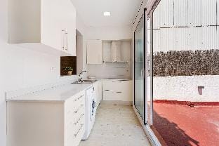 Gràcia Charm: Sunlit Terrace, AC & Exposed Brick Apartment in Barcelona