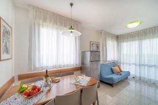 Spacious apartment with 2 balconies and shared pool by Beahost Rentals Apartment in Bibione