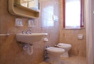 Experience comfort by the pool - Beahost Apartment in Bibione