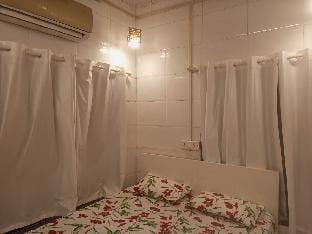 White Den part of bungalow Apartment in Mumbai