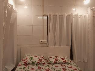 White Den part of bungalow Apartment in Mumbai