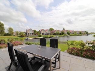 Nice holiday home on the water Vacation rental in Friesland, Netherlands