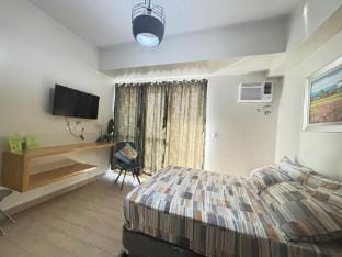 Unwind & Relax with a Sunset View at The Palladium Apartment in Iloilo City