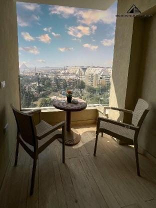 Imagine a Grand Museum &Pyramids View Central Room Apartment in Egypt