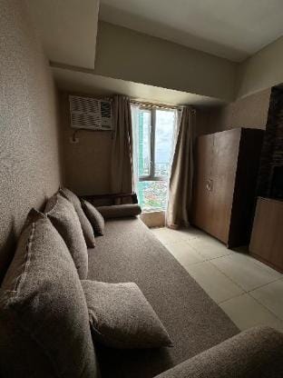 Homey Stay 1BR: pool, wifi, netflix ready Apartment in Lapu-Lapu City