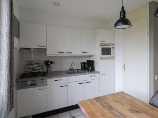 Nice holiday home on the water in Friesland Vacation rental in Friesland, Netherlands