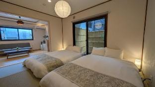 4 bedroom, 4 bath, 1 stop to KIX, 7 beds, Max 14 Vacation rental in Sennan