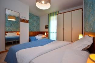 New apartment for 7 people with private garden and pool by Beahost Rentals Apartment in Bibione