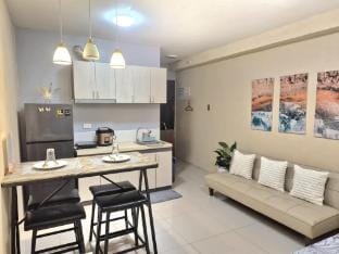 Snuggle in Bed Staycation near Mactan Airport Apartment in Lapu-Lapu City