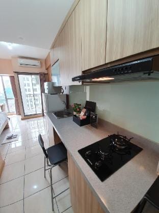 Comfort, and Homey Studio Apart at Gading Serpong Apartment in West Java