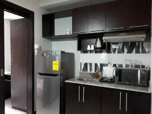 1 BR Home Suite in Eiffel Chateau Elysee Apartment in Paranaque