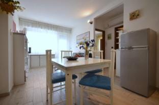 Charming three-room apartment with pool by Beahost Rentals Apartment in Lignano Sabbiadoro