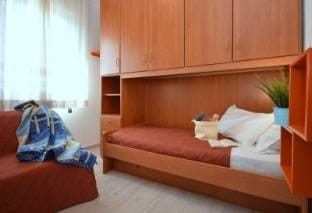 Charming three-room apartment with pool by Beahost Rentals Apartment in Lignano Sabbiadoro