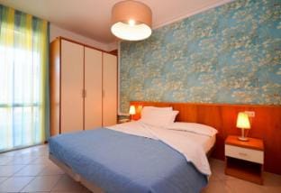 Modern and spacious apartment with private garden and pool Apartment in Bibione