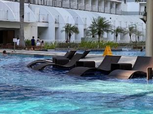 Air Condo Pool View Escape – Cozy 1BR w/ Sofa Bed Apartment in Pasay