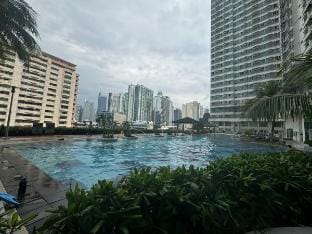 Free Pool | Central Location near Malls & Dining Apartment in Pasay