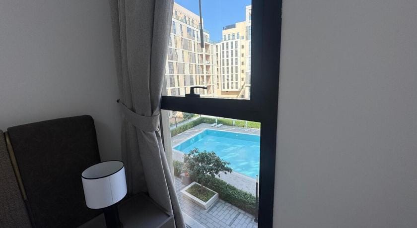 Panaromic pool view 1BR Apartment in Al Sharjah