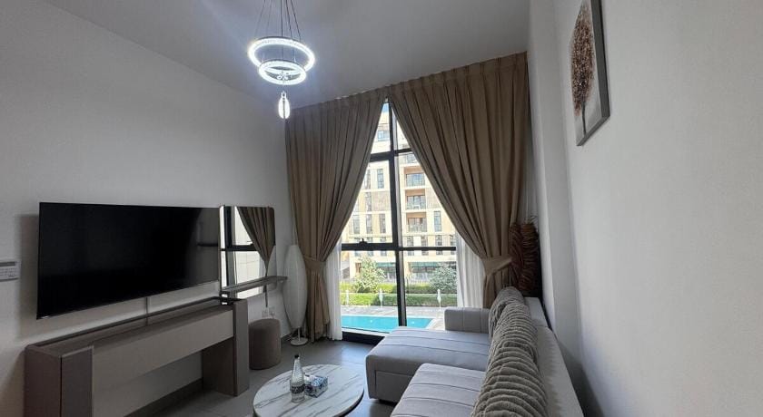 Panaromic pool view 1BR Apartment in Al Sharjah