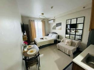 Condo near Mactan Cebu Airport with sea view balcony by LC Staycation Apartment in Lapu-Lapu City