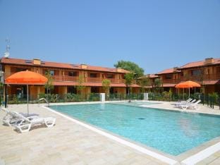 Gorgeous apartment with private garden by Beahost Rentals Apartment in Lignano Sabbiadoro