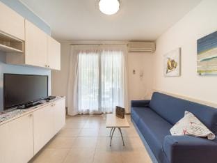 Gorgeous apartment with private garden by Beahost Rentals Apartment in Lignano Sabbiadoro