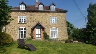 Dog friendly 7 bed farmhouse with hot tub and WiFi Farm Stay in Malvern Hills District