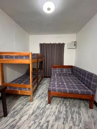 JAI Guesthouse by Honda Bay Rm 2 Vacation rental in Puerto Princesa