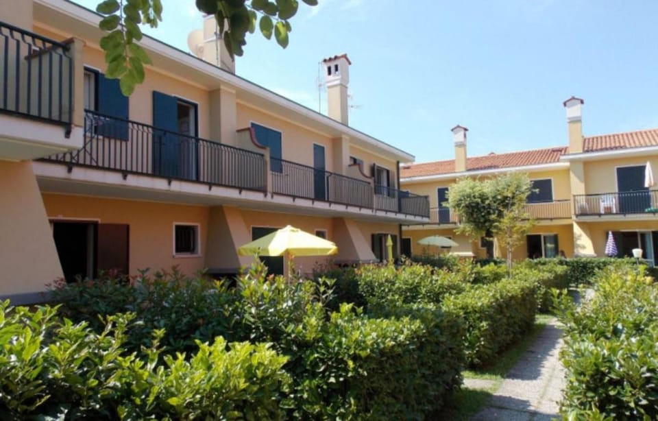 Cozy villa with private fenced garden and pool Apartment in Bibione