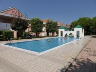 Spacious apartment with terrace and pool in Bibione Apartment in Bibione