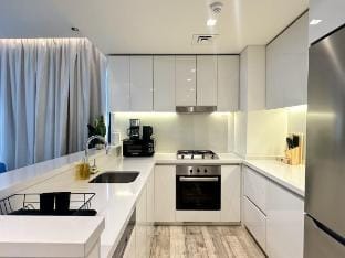 Vserve Modern Oasis: Canal & Burj Views Vacation rental in Dubai