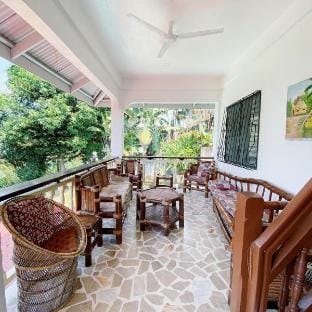Private fully air-conditioned Room in a Rest house Vacation rental in Puerto Galera