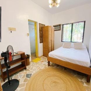 Private fully air-conditioned Room in a Rest house Vacation rental in Puerto Galera