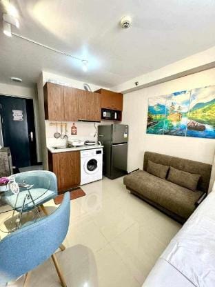 Condo near Airport with pool view balcony by LC Staycation Apartment in Lapu-Lapu City