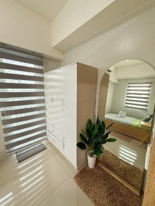 Spacious 1BR Unit+Balcony Grass T5 beside SM North Apartment in Quezon City