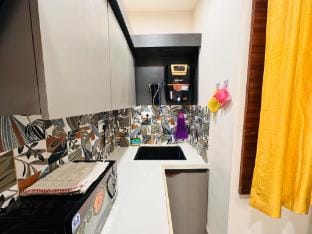 Home Escape 1BHK Bliss with Balcony Near Mahalaxmi Apartment in India