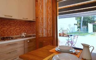 Calm, Comfort and Green Space in a Detached House Apartment in Bibione