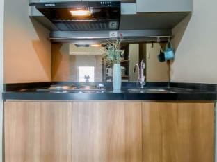 Minimalist 1BR Mustika Golf Residence By Travelio Apartment in West Java