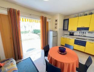 Ground floor apartment with private garden Villa in Bibione