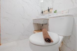 Simple 1BR at Grand Kamala Lagoon Apt By Travelio Apartment in West Java