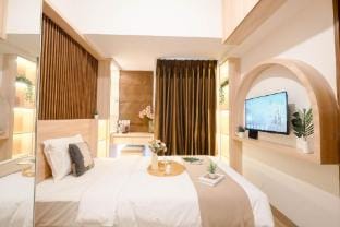 Warm Wood Studio Tokyo Riverside PIK 2 By Travelio Apartment in West Java