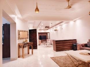 1 BHK- GK1 near M Block Market by HostMyStay Vacation rental in New Delhi